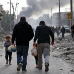 Families fleeing amid destruction from airstrikes in Lebanon.
