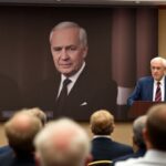 Norbert Lammert speaks at a podium about Adenauer.