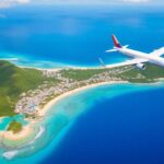 Aerial view of Port Vila and airplane heading to Australia.