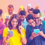 Diverse individuals using mobile devices to connect online.