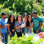Diverse participants collaborate outdoors for climate action workshop.
