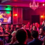 Stand-up comedians performing at JJ Bar comedy night.