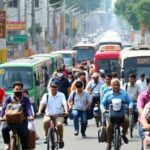 Diverse commuters in a busy urban environment.