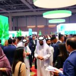 Delegates discussing sustainability at COP16 Riyadh.