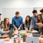 Diverse students collaborating in a modern office setting.
