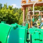 Industrial workers using eco-friendly technology in nature.