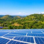 Lush Togo landscape with solar panels and wind turbines.