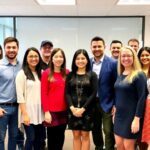 New team members at Health[e]Foundation in a bright office.