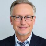 Jakob Granit, Director General of Sida, in a formal suit.
