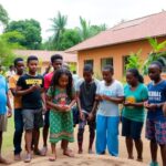 Diverse youth collaborating outdoors in Mozambique's vibrant landscape.