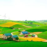 Green fields with wind turbines and solar panels.