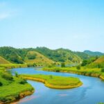 Lush Tanzanian landscape with water bodies and greenery.