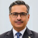 Portrait of TS Syed Mokhtar Albukhary in business attire.