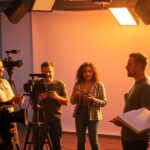 Diverse filmmakers collaborate on social justice documentary set.