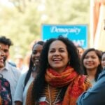 Diverse group discussing democracy outdoors at a community event.