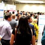 Researchers collaborating at an HIV science conference.