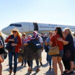 Australian citizens arriving home from humanitarian flights.