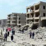 Devastated city in Syria showing need for rebuilding efforts.