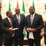 OPEC Fund meeting with Burundi Ambassador at conference table.