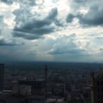 Dramatic landscape of a divided city amidst conflict.