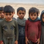 Kurdish children in a barren landscape, looking serious.