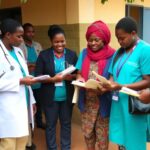 Healthcare professionals assisting diabetes patients in Tanzania.