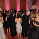 Glamorous attendees at an elegant awards ceremony.