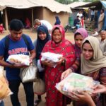 Volunteers providing aid in a disaster-stricken area.