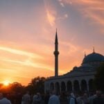 Mosque at sunset with believers in a serene landscape.