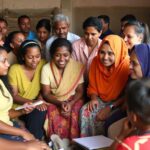 Diverse group collaborating to fight against poverty.