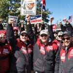 Unifor members celebrating after a successful strike.