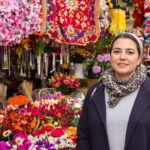 Ukrainian woman in marketplace, embodying resilience and entrepreneurship.
