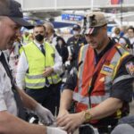 Unifor aviation member assisting passengers at the airport.