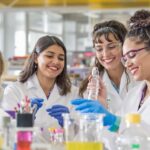 Diverse women scientists working together in a laboratory.