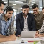 Diverse young professionals collaborating in a modern office.