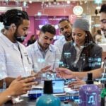 Diverse healthcare team collaborating with AI technology in health.