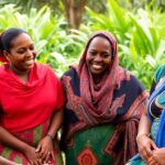 Dr. Stellah Bosire with Kenyan women in a lively setting.