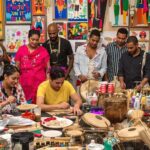 Diverse individuals engaging in cultural art and activities.