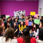 Diverse youth advocates gathered in a vibrant church setting.
