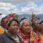 Mothers in Brazil united, showing strength and determination.