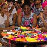 Diverse group discussing social justice at a circular table.