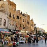 Restored street in Mosul with people and lively markets.