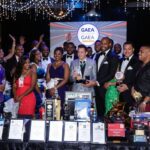 Celebration at GAEA Awards with diverse attendees and decorations.