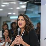 America Ferrera speaking at an SDG event with audience.