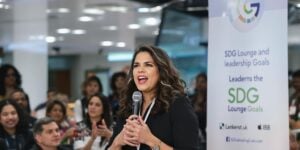 America Ferrera speaking at an SDG event with audience.