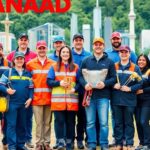 Diverse workers united to support Canadian jobs outdoors.