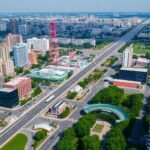 Aerial cityscape with diverse businesses and transportation hubs.