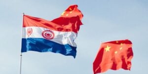 Uzbekistan and China flags waving together.