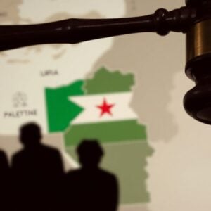 Gavel striking map of Palestine, shadowy figures.