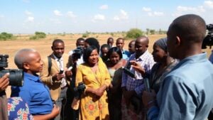 Journalists observe polio vaccination efforts in Africa.
